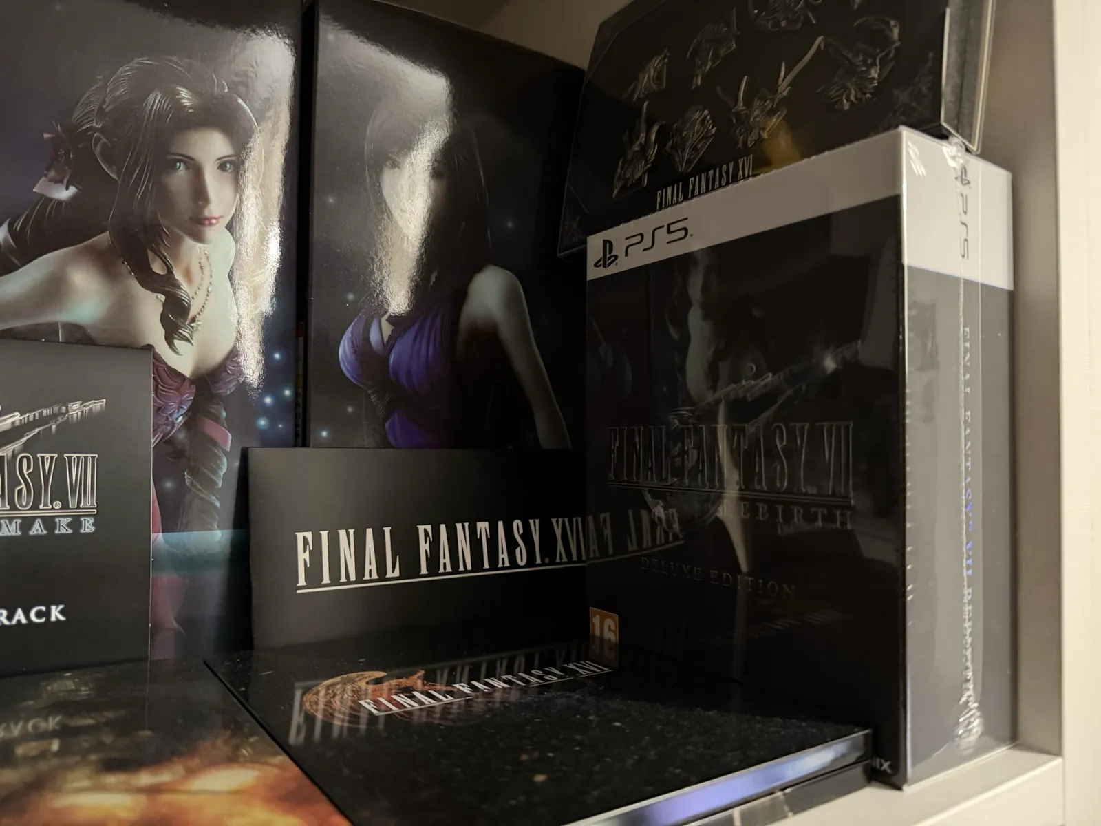 Sealed physical edition of Final Fantasy VII Rebirth next to other Final Fantasy collectibles