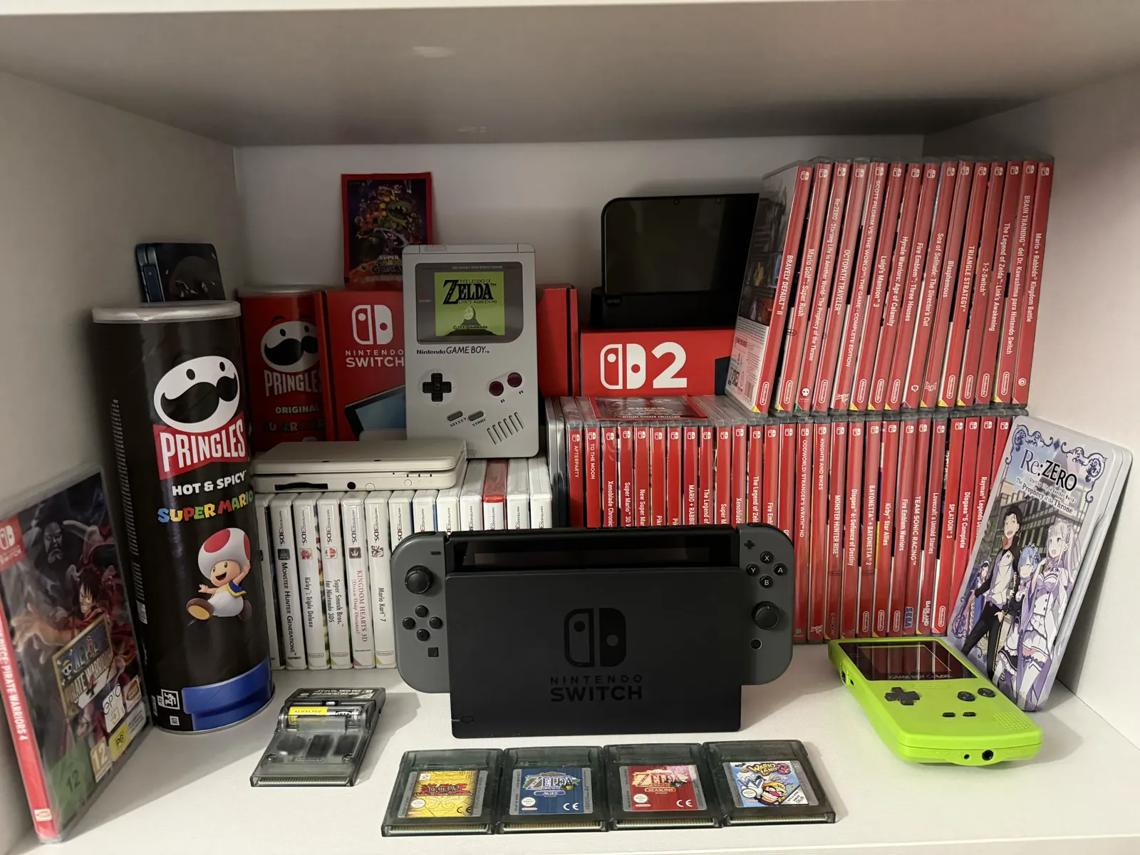 Collection of Nintendo games and consoles with Game Boy cartridges, Nintendo Switch and physical games